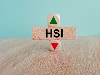 HSI price symbol. A brick block with arrow symbolizing that Hang seng index price are going down or...