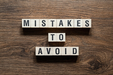 Mistakes to avoid - word concept on building blocks, text - obrazy, fototapety, plakaty