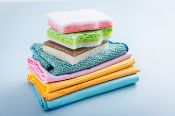 Obraz na płótnie Canvas Assortment of different sponges and cleaning rags, with fiber cloth and duster microfiber cloth