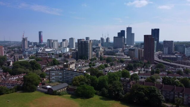 Drone shot flying backwards from Croydon city with modern skyscrapers