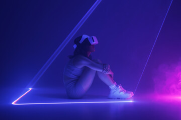 Fototapeta na wymiar Woman in futuristic costume. Girl in glasses of virtual reality while touching air. Augmented reality game, future technology, AI concept. VR. Neon blue and red light. Dark background.