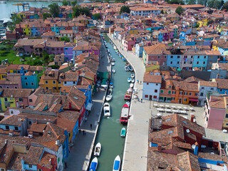 Burano positive colorful rainbow island. City on the water Venice. Drone view