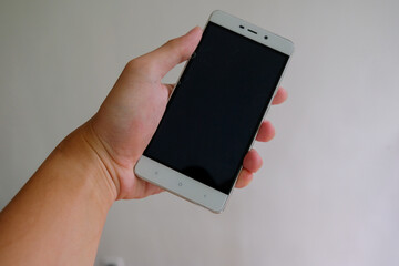 man holding smartphone white background