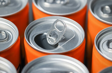 Aluminum cans top view, closeup opened can ring from sweet so da drink can orange flavor, natural light.