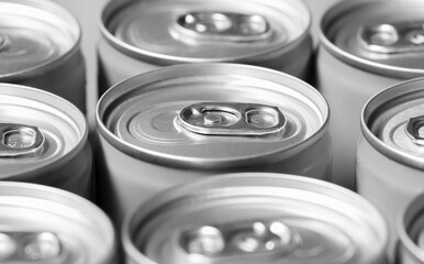 Closeup opening ring on top of soda drinks cans is monochrome color.