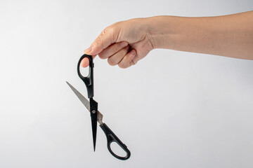 Office stationery scissors cutting in hand on white background