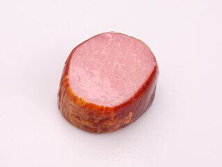 Smoked pork ham, isolated on a white background. Polish cold cuts, a packshot photo.
