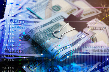 Money exchange. Double exposure of dollar banknotes and graphs