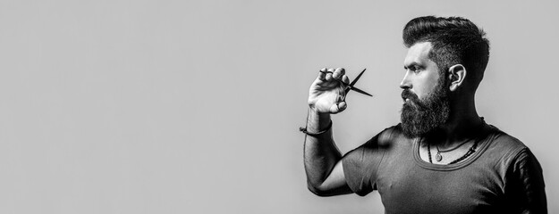 Mans haircut in barber shop. Barber scissors, barber shop. Barber scissors. Black and white