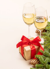 Xmas fir tree branch, Christmas gift box, champagne and space