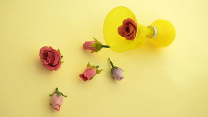 yellow trumpet with red and purple roses on a yellow background minimal creative concept celebartion of love 