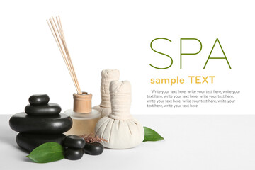 Composition with spa stones on table against white background. Design with space for text