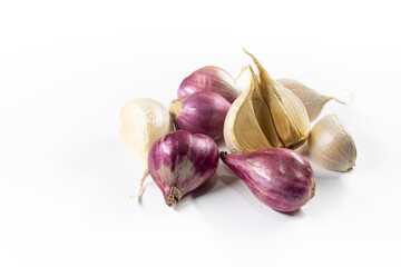 Photo of garlic and shallot cloves on white isolated background