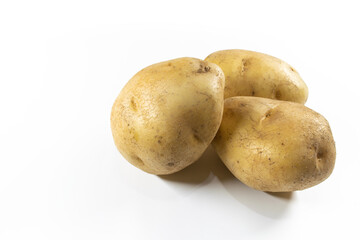 Image of potatoes on isolated white background showing various skin texture