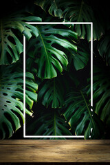 Wooden table Jungle wall vertical background on smartphone. Blurred green tropical palm leaves with monstera foliage forest. Selected focus