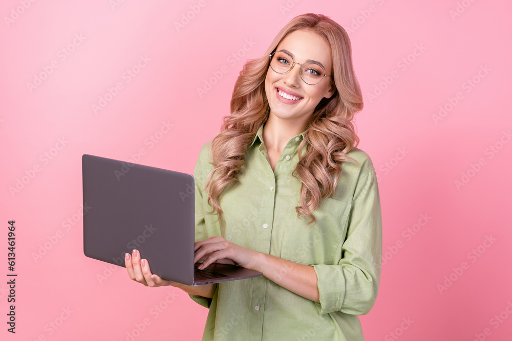 Poster Photo of positive pretty woman dressed green shirt eyewear working macbook modern device isolated pink color background