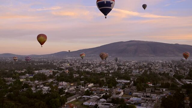 Dozens of hot air balloons soar over the city of Teotihuacan in Mexico. The city is home to the ancient Pyramids of the Moon and Sun, which are comparable in size to the pyramids of Egypt.