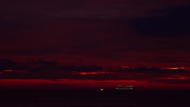 Cruise ship in red sky at twilight in the sea .This stunning image perfectly captures the beauty of the open ocean and the peacefulness of the night..Gradient color. Sky texture.red sky background.