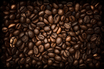 Brown coffee background.Dark with black vignette coffee background. Close-up of roasted coffee beans