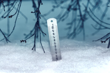 Ruler with scale.Yardstick measuring the depth of snow. - obrazy, fototapety, plakaty
