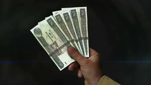 Ethiopia Birr money holding. Fan of banknotes in hand. ETB paper cash. Concept of income, success, business, tax, economy and finance.