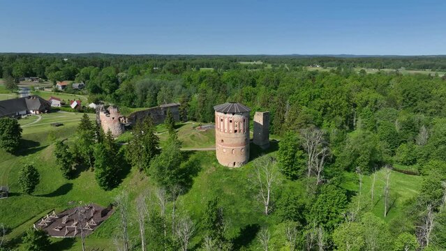 Aerial view of ruins of Vastseliina Episcopal Castle on a sunny day. Estonia.
