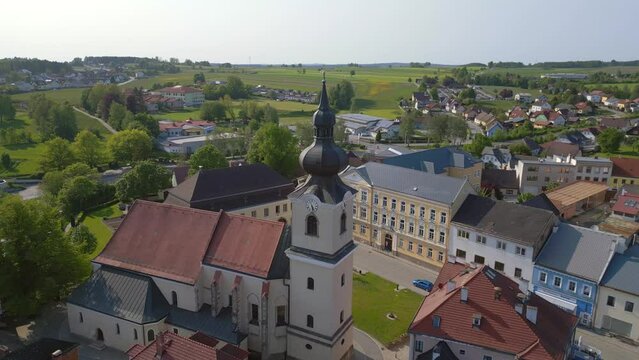 Stunning aerial top view flight 
Church in village Heidenreichstein, city in Austria Europe, summer day of 2023. fly reverse panorama overview drone
4K uhd cinematic footage.