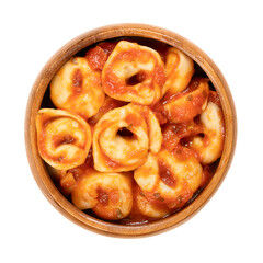Boiled tortellini, dressed in tomato sauce, in a wooden bowl. Industrially made, stuffed dumplings....