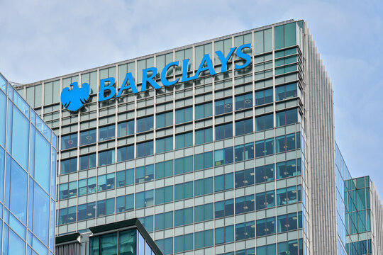 London, United Kingdom - May 18, 2023: Blue Barclays logo at top of their worldwide headquarters in Canary Wharf. It is British multinational investment bank, one of largest world banks