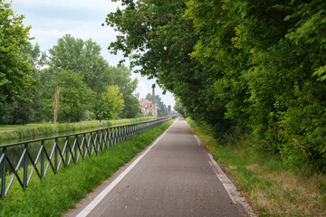 Fototapeta na wymiar Cycleway along the Naviglio Pavese from Milan to Pavia