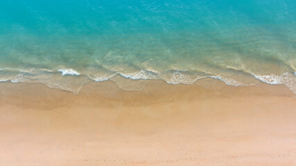 Aerial view with beach in wave of turquoise sea water shot, Top view of beautiful white sand background