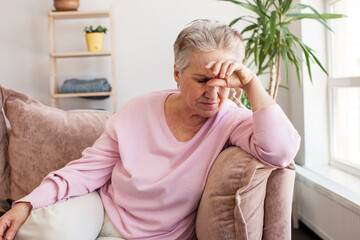 middle aged lady looking away sit alone at home feel anxious lonely, sad