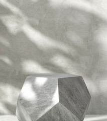 Modern geometric shape gray granite stone podium table, pentagon side in sunlight, leaf foliage...