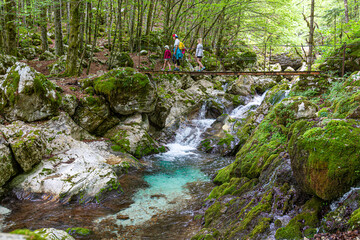 Slovenia, Goriska region, Bovec, Triglav National Park, River Soča, Lepenjica, family on a hiking tour © mmphoto