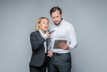 two business partners colleagues analyze information using smartphone and tablet