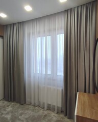 Fototapeta na wymiar This stunning photograph showcases beautiful curtains that would be the perfect addition to any home