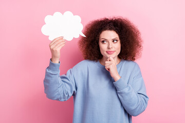 Photo of young girl funny hairdo wear blue shirt touch chin hold bubble cloud look interested genius plan isolated on pink color background