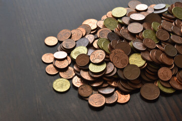 Euro cent coins on wood table. 