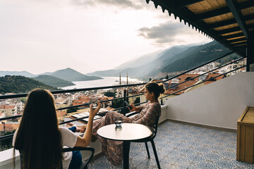 Two young girlfriends enjoy a beautiful view