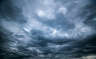 Naklejka na ściany i meble Dark sky with stormy clouds. Dramatic sky ,Dark clouds before a thunder-storm.