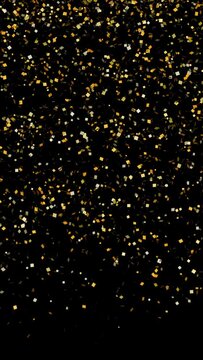 Gold glitter falling, with luma matte. Loop between 6:00-9:00. Vertical video.