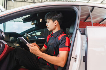Auto mechanic performs car diagnostics wirelessly. Scan for errors and find breakdowns using a...