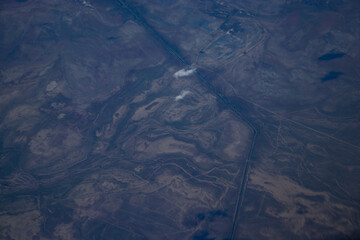 A view of the mountains from the height of an airplane. Beautiful scenery of nature, the beauty of the mountains.