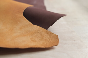 arrangement of premium beige leather, exhibiting the beauty and diversity of natural materials. The...