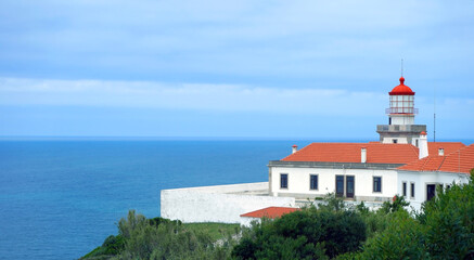 Fototapeta na wymiar View with lighthouse Farol do Cabo Mondego, Figueira da Foz, Portugal 