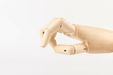 Wooden hand isolated on a white background. Copy space