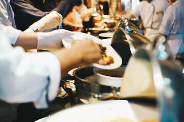 People hand grab buffet food serve in hotel seminar room