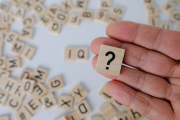 question mark, wooden letters on wooden table, intelligence quotient on wooden background,...