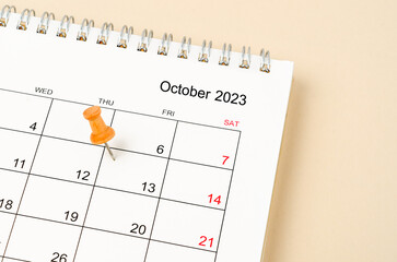 Close up the wooden pin marked on Friday 13 October calendar 2023.
