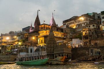 Fototapeta na wymiar India Varanasi ganga ghat at night, view of the crowded banks of people and funeral pyres